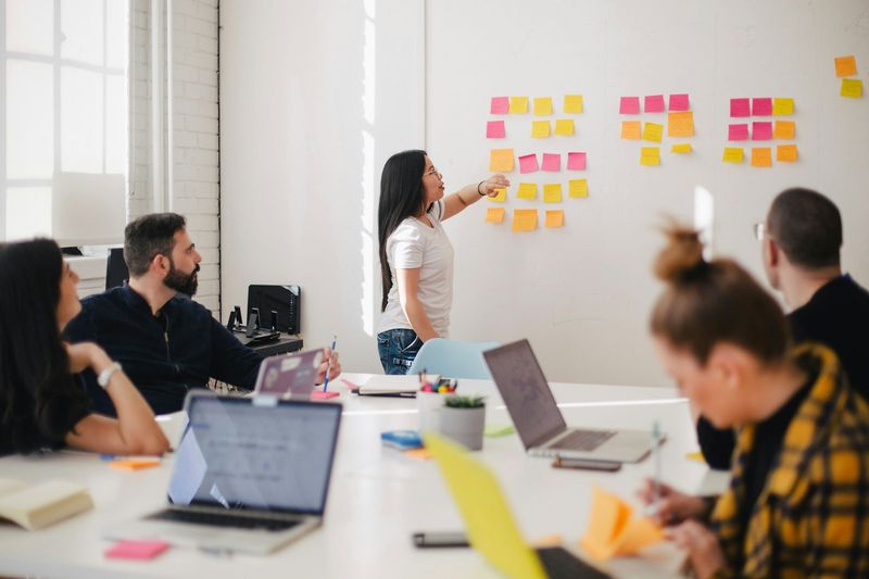Catalyst Prime strategist leading a planning workshop with sticky notes on a whiteboard